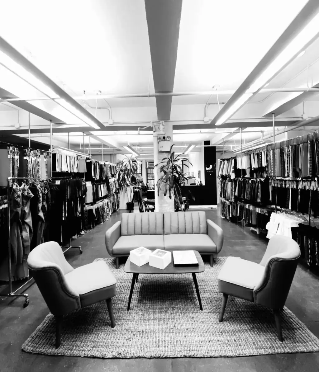 The New York showroom in black and white, swatch racks running the length of the room